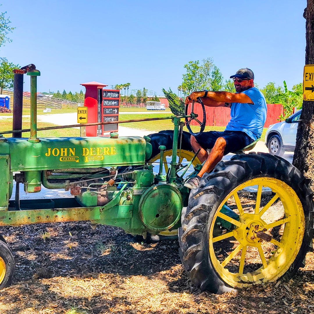 Johnny sitting on a tractor on site at Hunsader Farms.