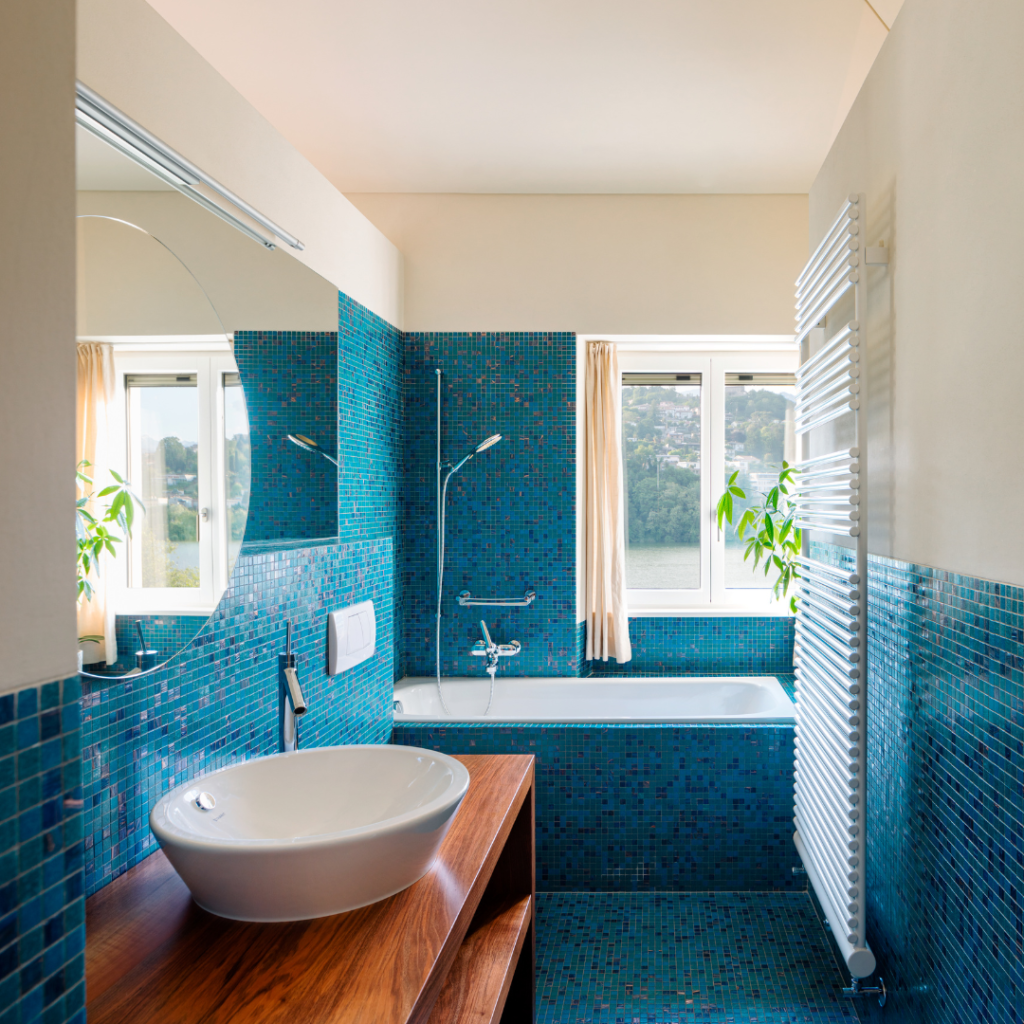 A bathroom decorated with teal coastal sparkle tile.